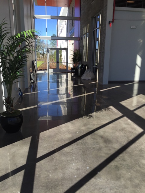 Micro Matic mechanically polished concrete floors by Concrete Polishing, Inc. in new office expansion.
